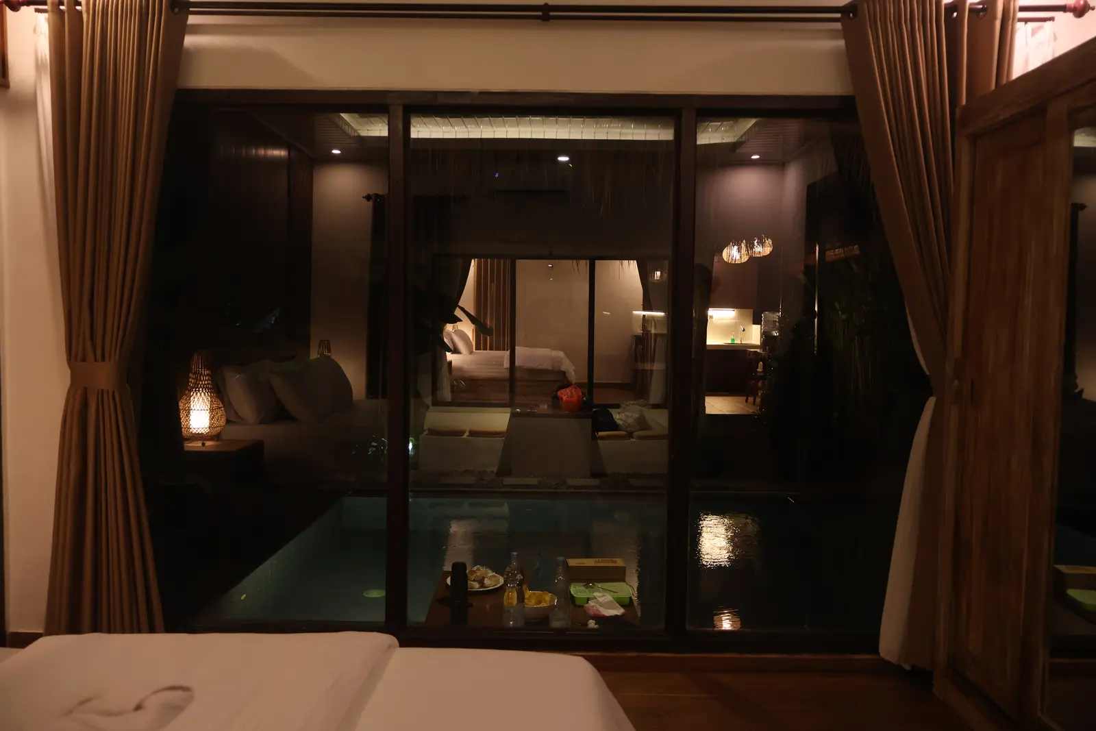 Bedroom looking across the pool in the evening