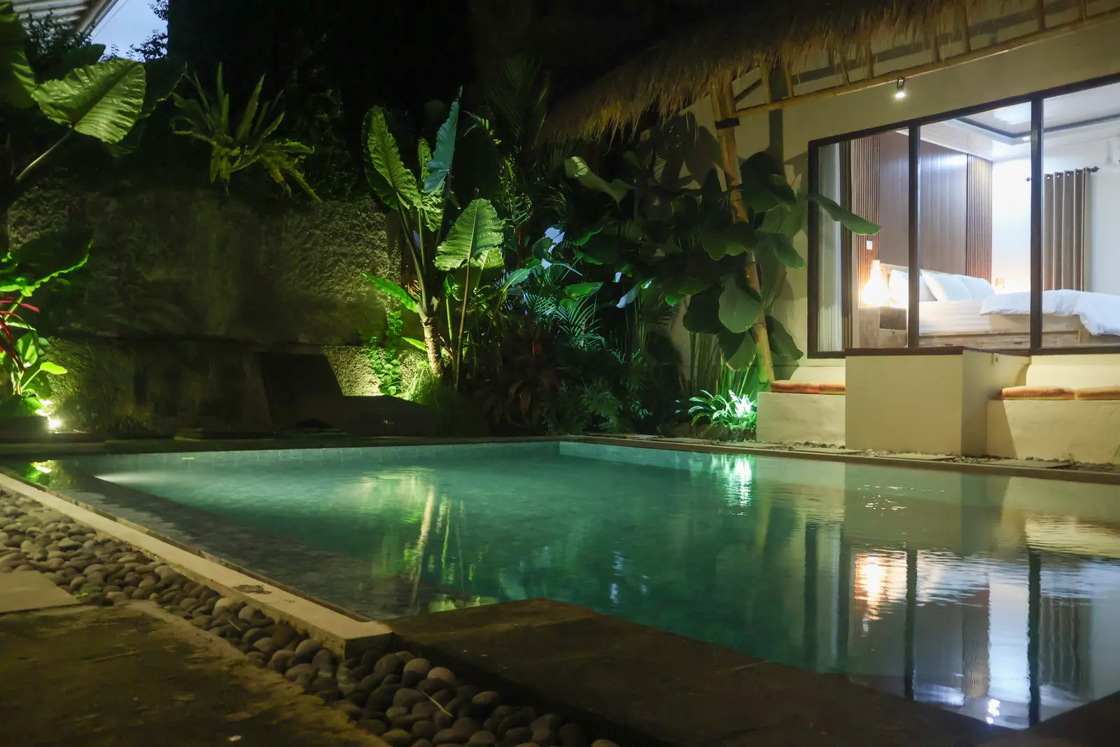 Private pool and bedroom after dark